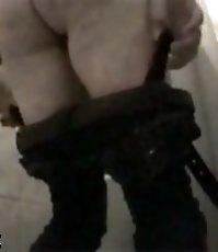Huge wrinkled ass in front of spy cam in public WC