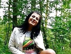 Hot brunette shows smoothie while pissing alfresco