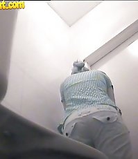 Horny voyeur plants his cam in public ladies' room