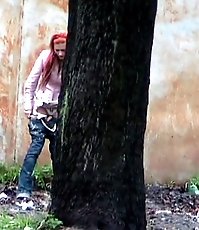 Hot girl with red hair filmed on the sly having a pee