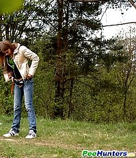 Cute kitty gets spycammed while peeing in the bushes