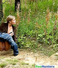 Blonde ho pissing in the middle of a country road
