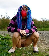 Naughty teen with a pink and blue hair caught peeing