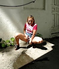 Nasty teen slut takes a piss in the backstreet