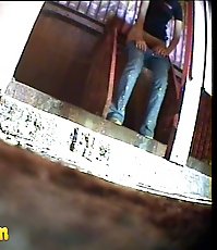 Pissing girl get busted and filmed in public loo