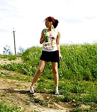 Shameless puss urinates on a deserted country road