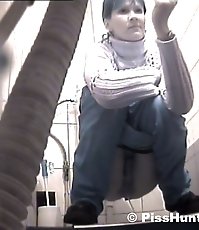 Two peeing girls unaware of spy cam in toilet