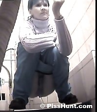 Two peeing girls unaware of spy cam in toilet