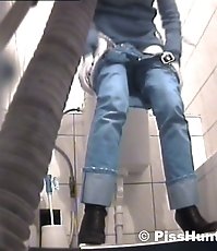 Voyeur peeps after two babes in public toilet