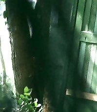 Babe in crimson piddles outdoors unaware of spying