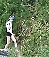 Exclusive spy video of a girl peeing in the bush